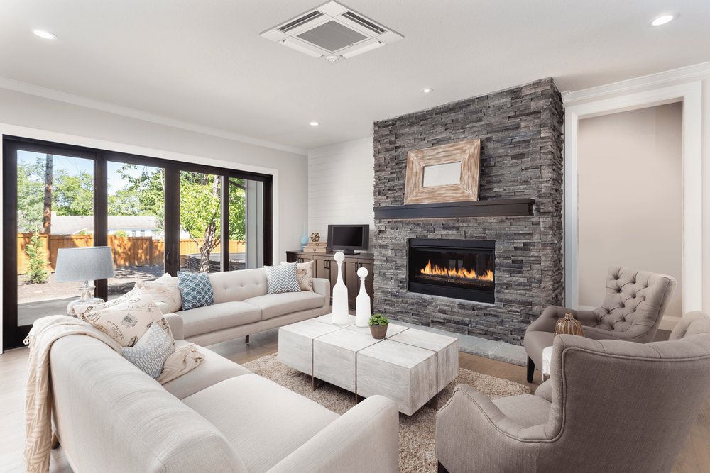 A Mitsubishi four-way ceiling cassette in a living room ceiling