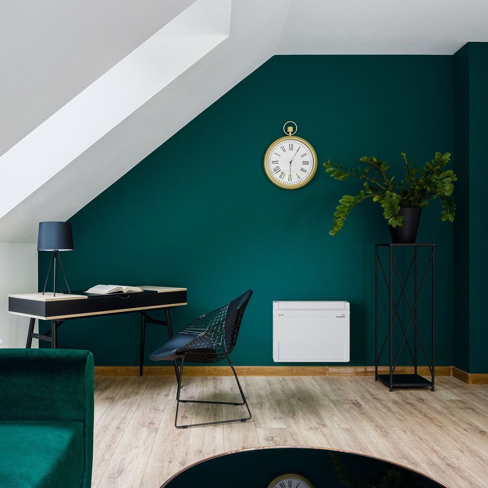 A Mitsubishi floor console low on a home office wall