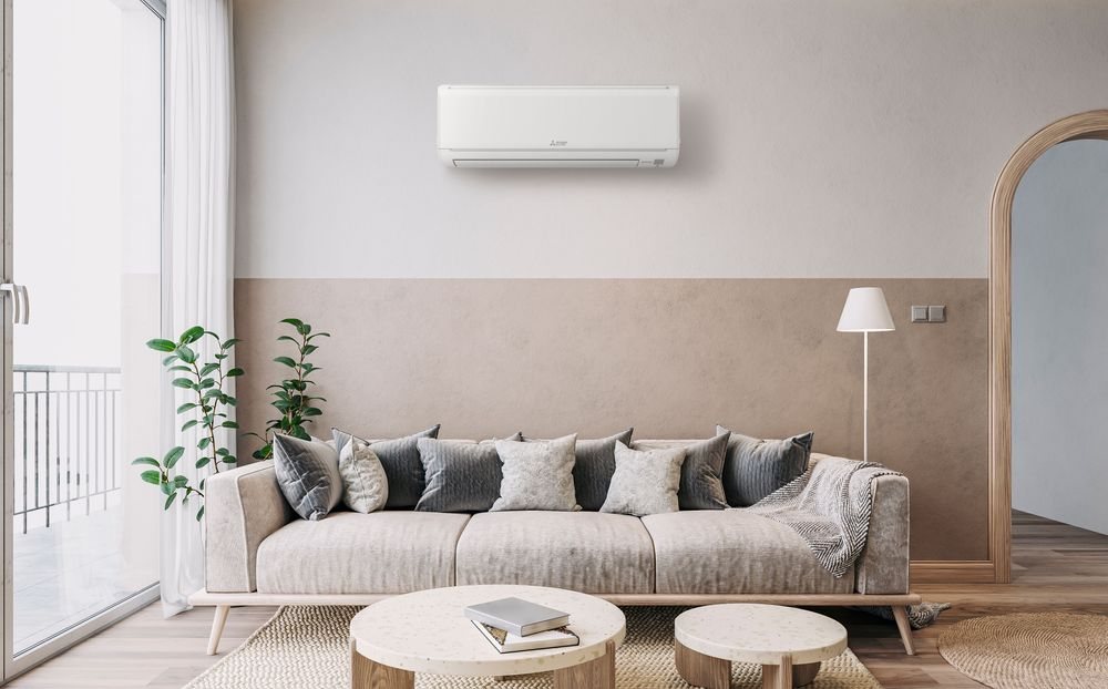 A Mitsubishi wall-mounted unit high on a living room wall